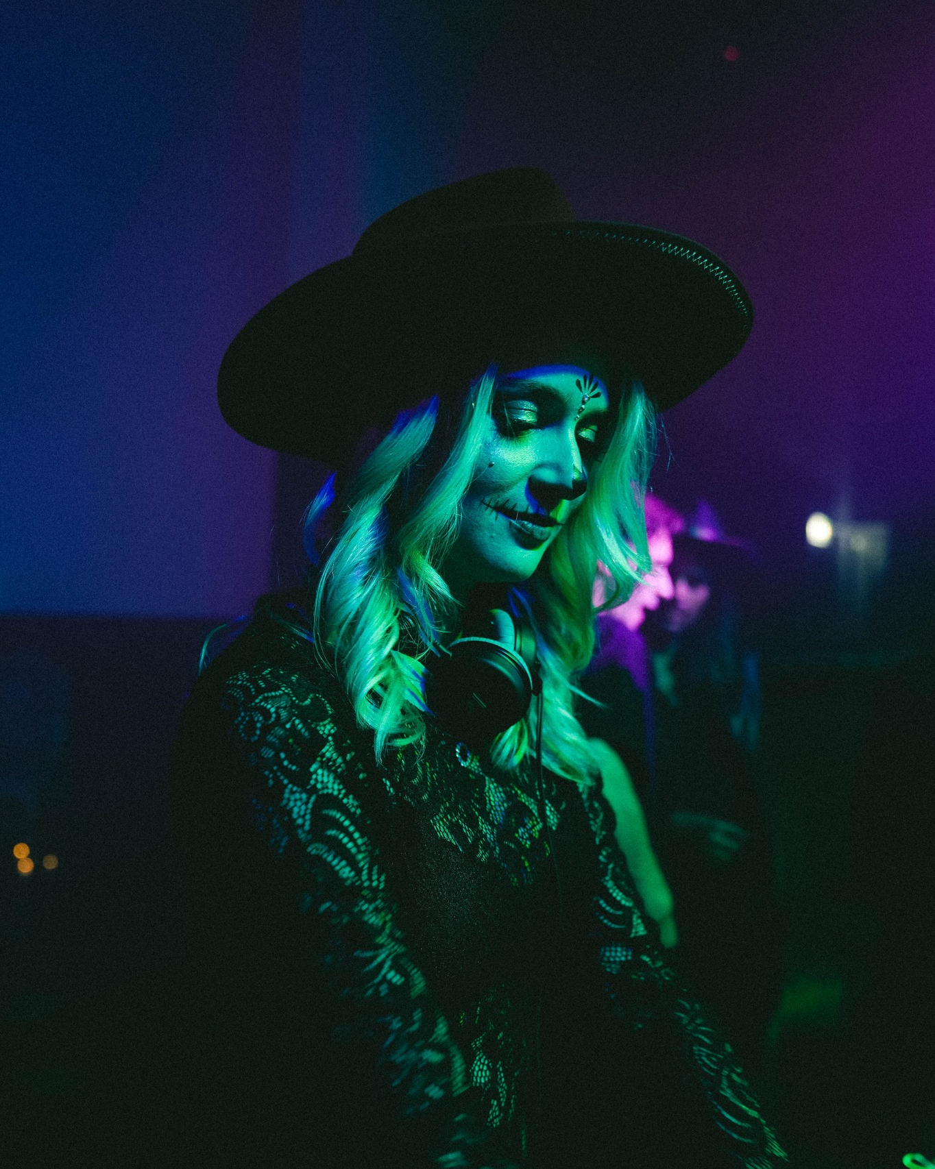 DJ playing in green light
