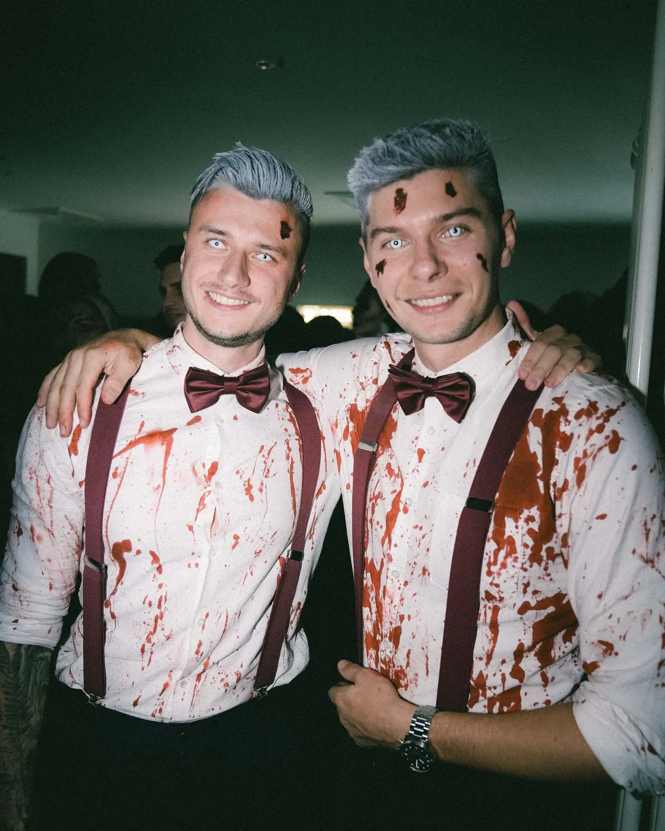 Two guests smiling at an event